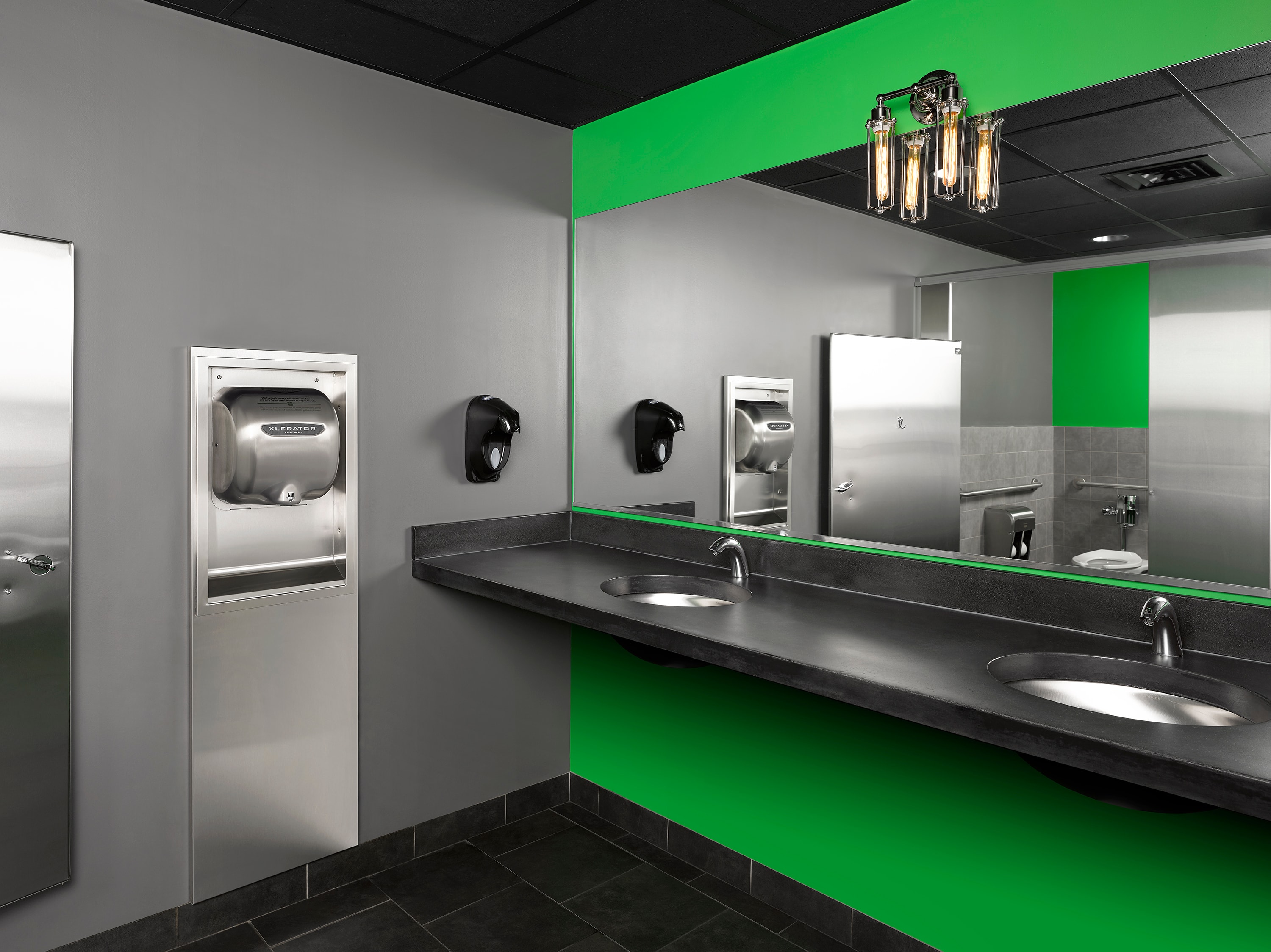Modern commercial restroom with XLERATOR hand dryer, sensor faucets, and designer sinks — Renew Restrooms Grant