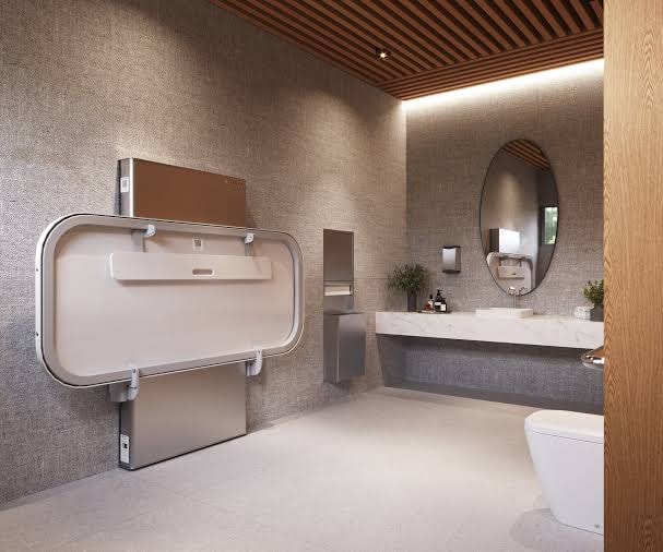 Sova adult changing station installed in a modern accessible restroom