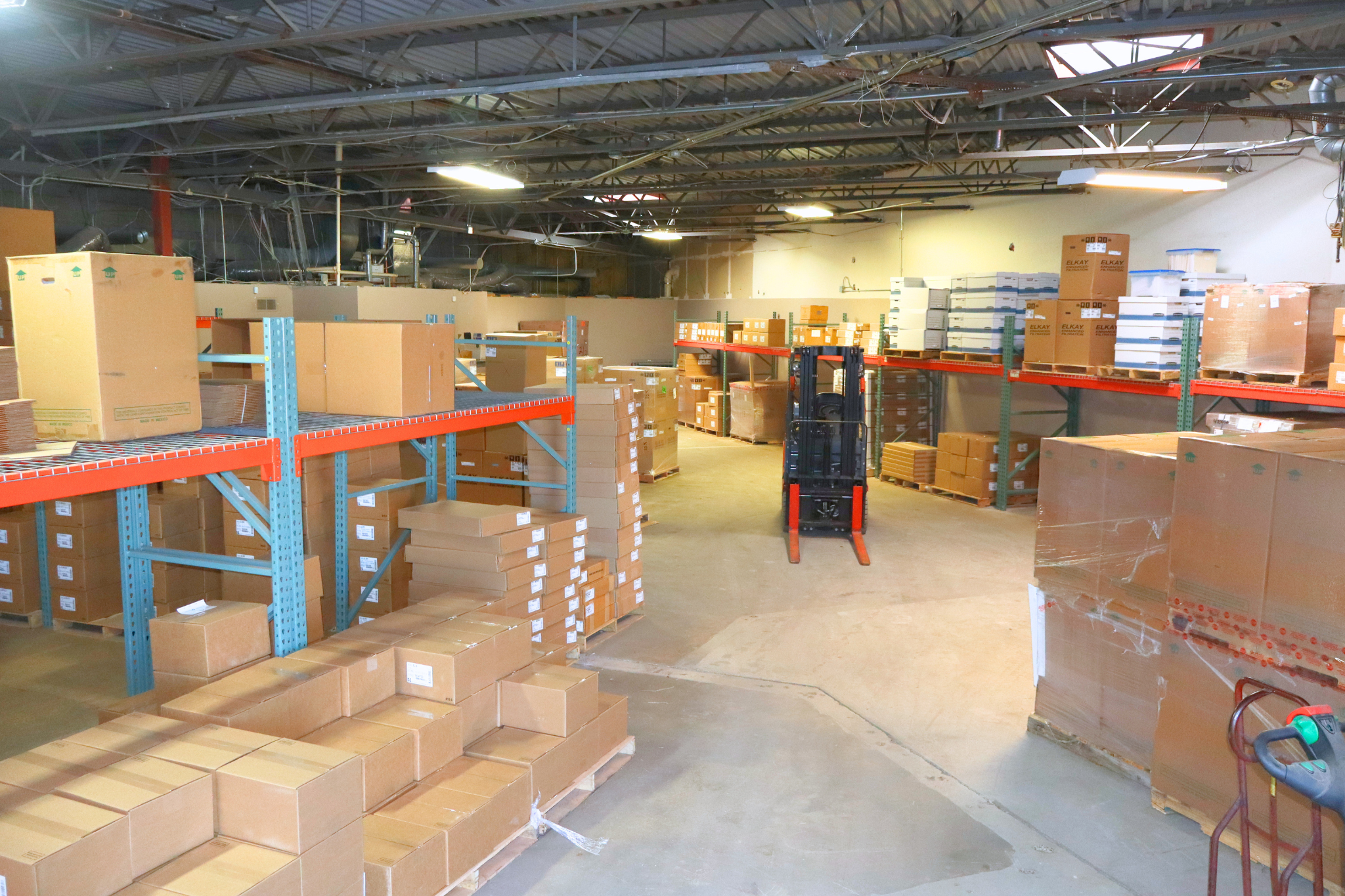Category Five Technologies warehouse with racking and Elkay inventory