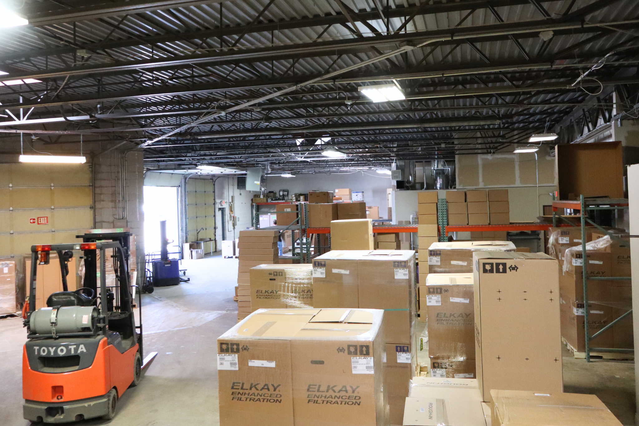 Category Five Technologies warehouse with Toyota forklift and Elkay inventory