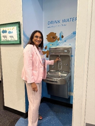 Nayna Patel with the new Elkay bottle filling station and drinking fountain at Children's Discovery Museum of San Jose