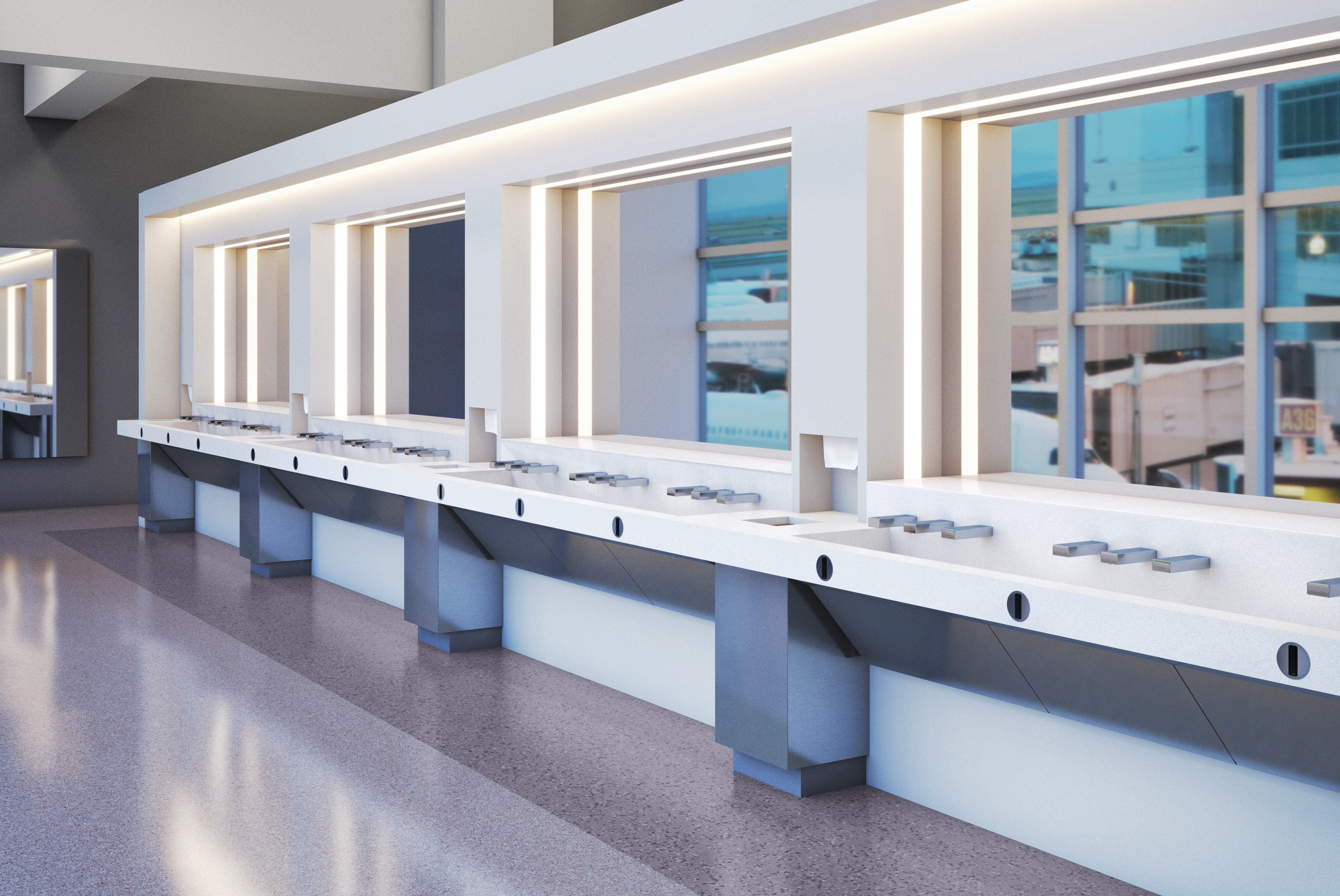 Custom airport trough sink station with integrated faucets, LED-lit mirrors, and floor-to-ceiling windows overlooking the tarmac