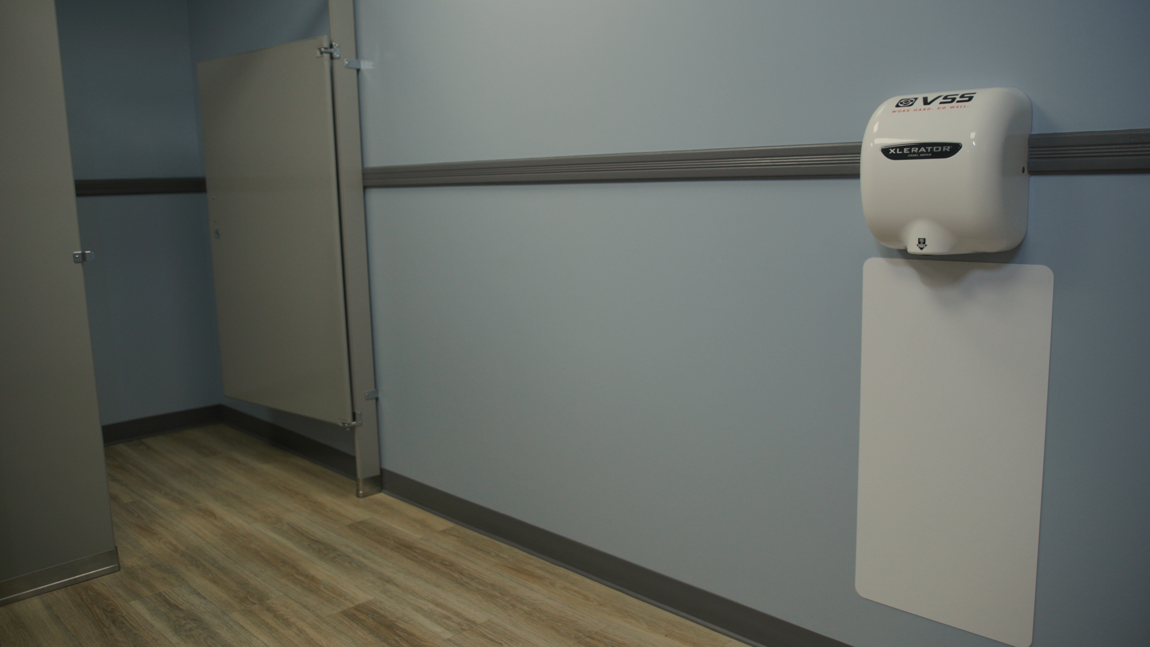 Commercial hand dryers in restroom — 4K video still