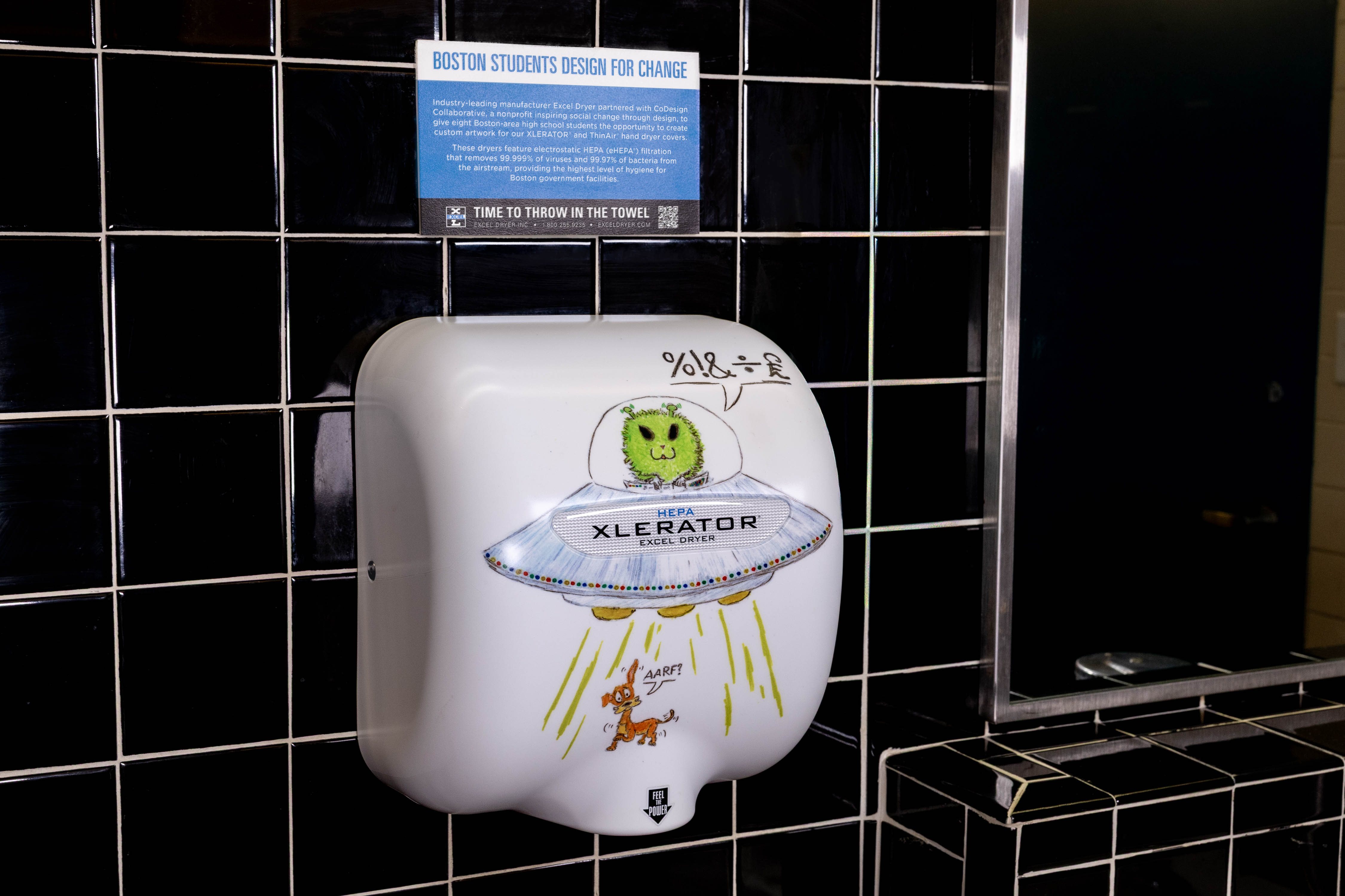 Excel XLERATOR HEPA hand dryer with custom student artwork — CoDesign Boston