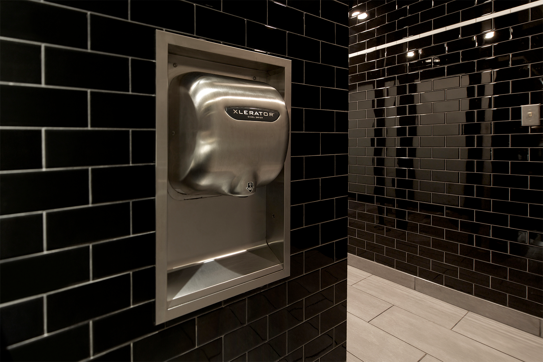 Excel XLERATOR hand dryer installed at Max Burger commercial restroom